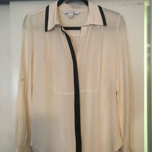 DVF cream colored blouse with black trim